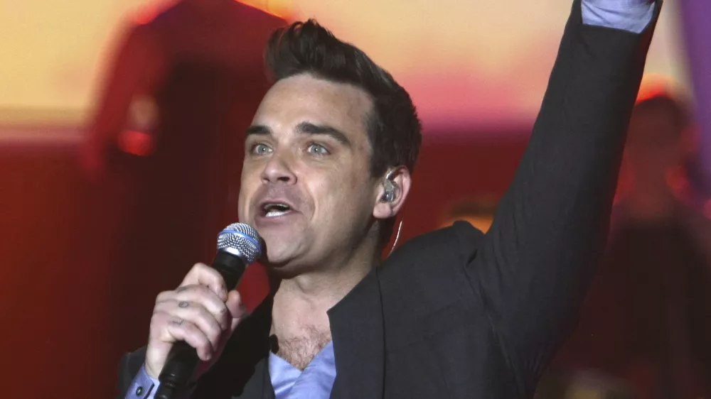 Robbie Williams bo zvezda julijskega koncerta v Trstu. /&nbsp;Foto: AP