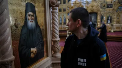 A recovering Ukrainian soldier looks at the icon of a saint inside the church of the Skete of Prophet Elijah in Mount Athos, Greece, November 26, 2024. In their four-day stay, part of a psychological support programme organised by Ukrainian authorities, the 22 soldiers made a pilgrimage to some dozen monasteries on the slopes of Mount Athos, a spiritual centre since the 10th century. "A lot of servicemen suffer from the events that took place over the last three years. A lot of them suffer from different illnesses &ndash; they are wounded, and we have to rehabilitate them," said Father Mykhailo Pasirskyi, a Ukrainian Orthodox priest. REUTERS/Alexandros Avramidis     SEARCH "AVRAMIDIS UKRAINE ATHOS" FOR THIS STORY. SEARCH "WIDER IMAGE" FOR ALL STORIES.