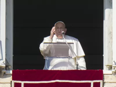 Pope Francis appears at his studio's window overlooking St. Peter's Square at The Vatican to bless pilgrims and faithful after presiding over a mass in St. Peter's Basilica on New Year's Day, Wednesday, Jan. 1, 2025. (AP Photo/Andrew Medichini)