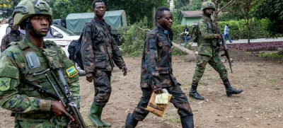 Rwandan security officers escort members of the Armed Forces of the Democratic Republic of the Congo (FARDC), who surrendered in Goma, eastern Democratic Republic of Congo following fighting between M23 rebels and the FARDC, in Gisenyi, Rwanda, January 27, 2025. REUTERS/Jean Bizimana