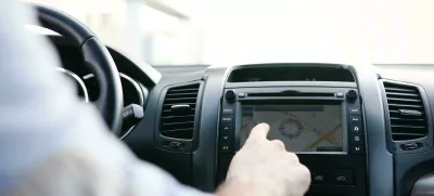 KME2MR Man using navigation system while driving car