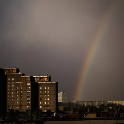 A rainbow appears in the sky over residents buildings in the German capital during a thunderstorm in Berlin, Tuesday, April 16, 2024. (AP Photo/Markus Schreiber)