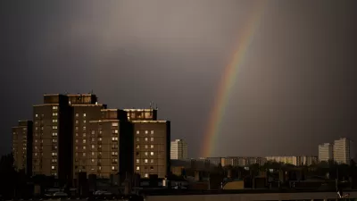 A rainbow appears in the sky over residents buildings in the German capital during a thunderstorm in Berlin, Tuesday, April 16, 2024. (AP Photo/Markus Schreiber)