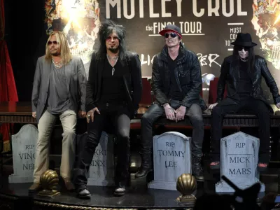 Members of rock band Motley Crue (from L-R) Vince Neil, Nikki Sixx, Tommy Lee and Mick Mars pose at a news conference announcing The Final Tour in Hollywood, California January 28, 2014. REUTERS/Mario Anzuoni (UNITED STATES - Tags: ENTERTAINMENT TPX IMAGES OF THE DAY)
