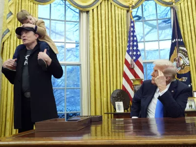 President Donald Trump listens as Elon Musk, joined by his son X &AElig; A-Xii, speaks in the Oval Office at the White House, Tuesday, Feb. 11, 2025, in Washington. (Photo/Alex Brandon)