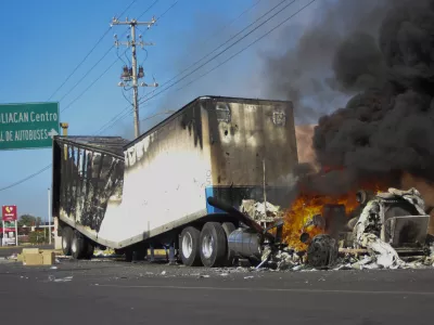 FILE - A truck burns on a street in Culiacan, Sinaloa state, Mexico, Jan. 5, 2023, after Mexican security forces captured Ovidio Guzm&aacute;n, a son of former Sinaloa cartel boss Joaqu&iacute;n "El Chapo" Guzm&aacute;n, which set off gunfights and roadblocks. (AP Photo/Martin Urista, File)