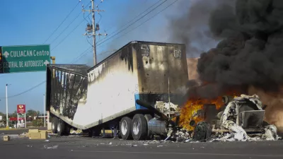 FILE - A truck burns on a street in Culiacan, Sinaloa state, Mexico, Jan. 5, 2023, after Mexican security forces captured Ovidio Guzm&aacute;n, a son of former Sinaloa cartel boss Joaqu&iacute;n "El Chapo" Guzm&aacute;n, which set off gunfights and roadblocks. (AP Photo/Martin Urista, File)