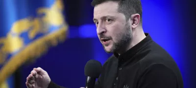 Ukrainian President Volodymyr Zelenskyy answers media questions during his press conference, in Kyiv, Ukraine, Sunday, Feb. 23, 2025. (AP Photo/Evgeniy Maloletka)