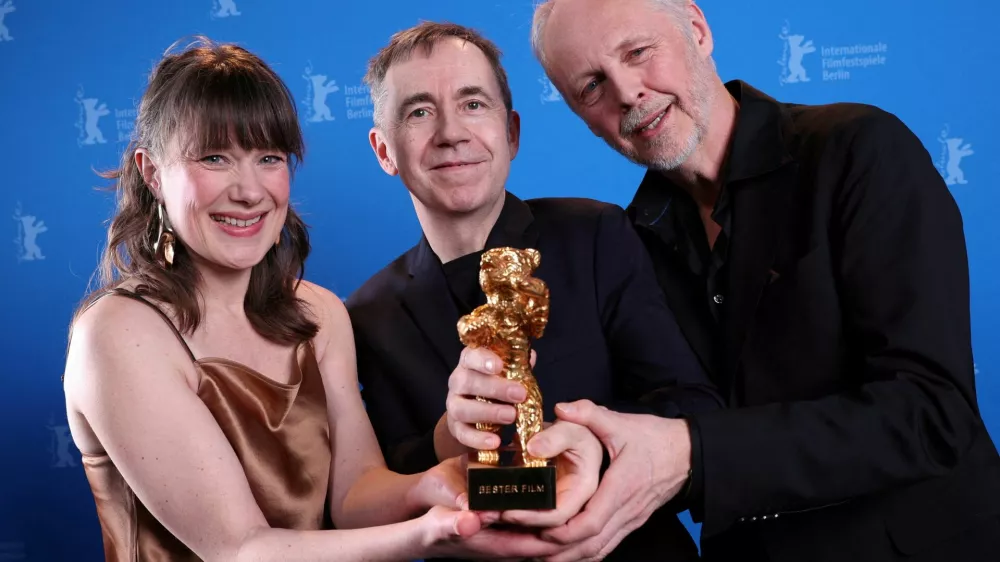 Norwegian director and screenwriter Dag Johan Haugerud poses with producers Yngve Saether and Hege Hauff Hvattum and the Golden Bear for Best Film award during the winner's photocall of the 75th Berlinale International Film Festival in Berlin, Germany, February 22, 2025.   Ronny Hartmann/Pool via REUTERS CORRECTING SURNAME FROM "HVATTUMON" TO "HVATTUM".