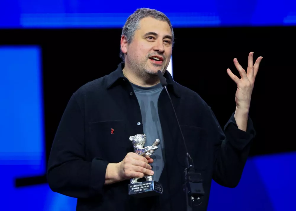 Radu Jude receives the Silver Bear for Best Screenplay for "Kontinental '25" during the awards ceremony at the 75th Berlinale International Film Festival in Berlin, Germany, February 22, 2025. REUTERS/Fabrizio Bensch