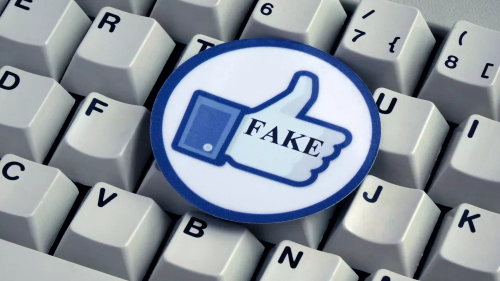 ILLUSTRATION - A "Like" button with the word "FAKE" on it lies on top of a computer keyboard. Taken on 18.12.2016. Facebook is a social network run by the US-American company of the same name, Facebook Inc. Despite serious criticism, Facebook does not want to take on responsibility for deleting so-called "fake news" themselves. Instead they will give a team of external experts the task. "Fake news" refers to false and incorrect information, often spread on purpose via electronic channels (mainly social media). They are deliberately spread by journalists, office-holders, politicians, companies and private individuals. - NO WIRE SERVICE - Photo by: Sascha Steinach/picture-alliance/dpa/AP Images
