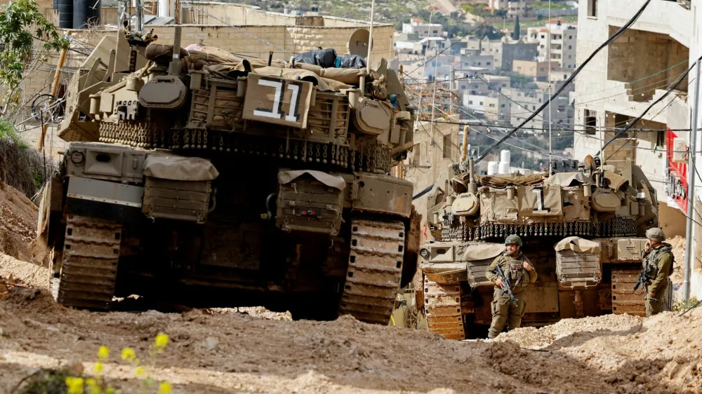 Israeli soldiers take part in an operation in Jenin, in the Israeli-occupied West Bank, February 24, 2025. REUTERS/Raneen Sawafta