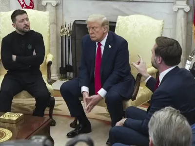 Vice President JD Vance, right, speaks with Ukrainian President Volodymyr Zelenskyy, left, as President Donald Trump listens in the Oval Office at the White House, Friday, Feb. 28, 2025, in Washington. (AP Photo/ Mystyslav Chernov)