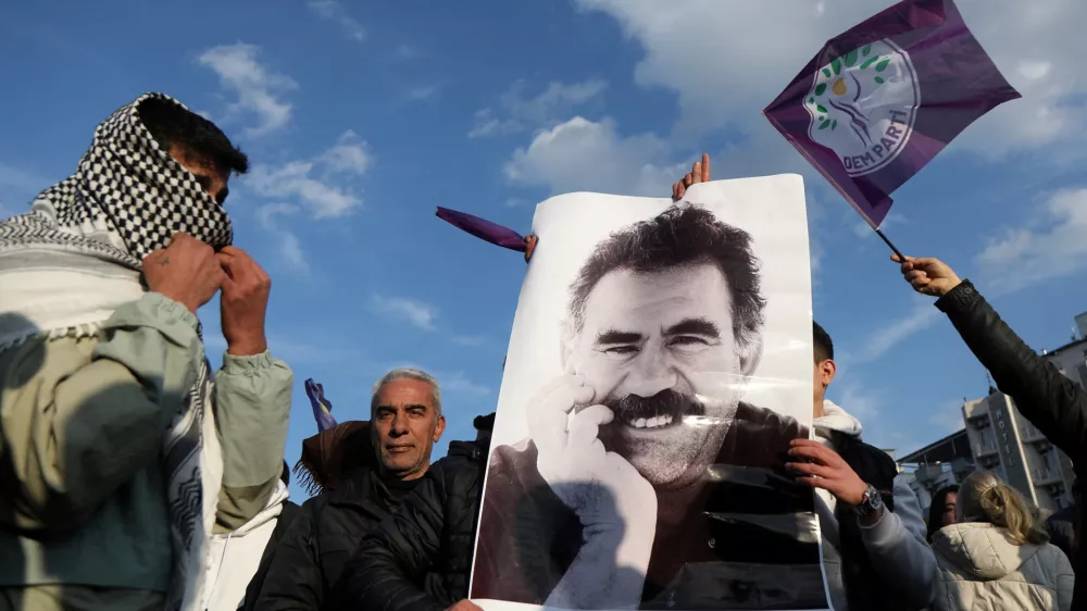 FILE PHOTO: A demonstrator holds a picture of jailed Kurdish militant leader Abdullah Ocalan during a rally in Diyarbakir, Turkey, February 27, 2025. REUTERS/Sertac Kayar/File Photo