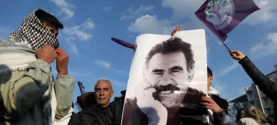 FILE PHOTO: A demonstrator holds a picture of jailed Kurdish militant leader Abdullah Ocalan during a rally in Diyarbakir, Turkey, February 27, 2025. REUTERS/Sertac Kayar/File Photo