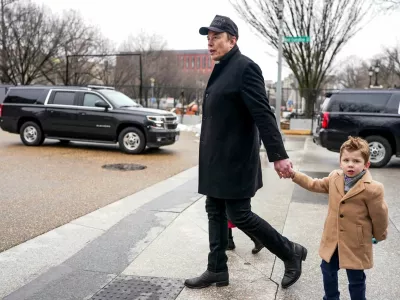FILE PHOTO: Elon Musk walks with his son X &AElig; A-12, on the day he met with Indian Prime Minister Narendra Modi at Blair House, in Washington, D.C., U.S., February 13, 2025. REUTERS/Nathan Howard/File Photo