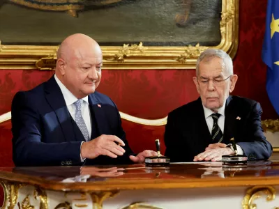 Austria's President Alexander Van der Bellen and head of People's Party (OeVP) and the new Chancellor Christian Stocker attend the swearing-in ceremony of a new government at Hofburg Palace in Vienna, Austria, March 3, 2025. REUTERS/Leonhard Foeger