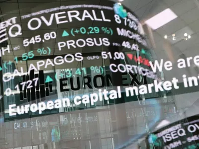 The reflection of a digital board showing trading data at the Euronext stock exchange in the La Defense business district in Paris, France, March 10, 2025. REUTERS/Benoit Tessier