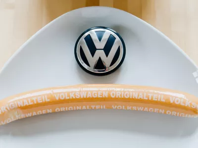 ILLUSTRATION - 19 February 2016, Lower Saxony, Hanover: A still-packaged VW currywurst with the inscription "Volkswagen Genuine Part" is displayed. The core car business is weakening, but German auto giant Volkswagen (VW) was able to set a sales record for an unexpected product in 2024: sausages. Photo: Julian Stratenschulte/dpa