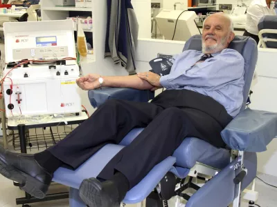 In this May, 2011, photo provided by Australian Red Cross Lifeblood donor James Harrison, credited with saving 2.4 million babies through his record-breaking blood plasma donations over decades, is giving blood at donation center in Sydney. (Australian Red Cross Lifeblood via AP)