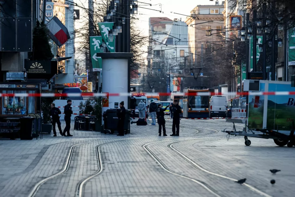 Police officers work at the site where a car drove into a crowd, in Mannheim, Germany, March 3, 2025. REUTERS/Heiko Becker