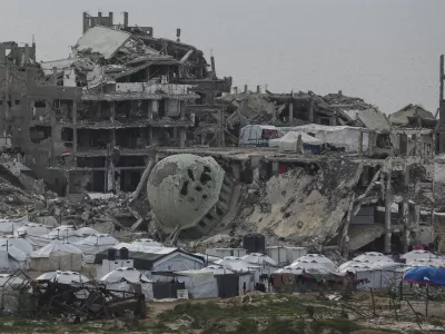 A tent camp for displaced Palestinians is set up amid destroyed buildings in the west of Al-Shati camp, west of Gaza City, on Monday, March 3, 2025. (AP Photo/Jehad Alshrafi)