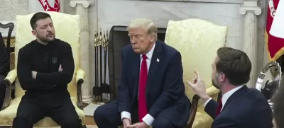Vice President JD Vance, right, speaks with Ukrainian President Volodymyr Zelenskyy, left, as President Donald Trump listens in the Oval Office at the White House, Friday, Feb. 28, 2025, in Washington. (AP Photo/ Mystyslav Chernov)