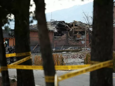 Officials stand near damaged buildings after South Korea's Air Force said that Mk82 bombs fell from a KF-16 jet outside the shooting range during joint live-fire exercises near the demilitarized zone separating two Koreas in Pocheon, South Korea, March 6, 2025. REUTERS/Kim Hong-Ji