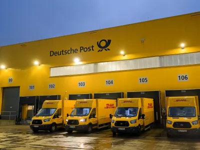 FILE PHOTO: Delivery cars are lined up at a distribution centre of German postal and logistics group Deutsche Post DHL in Hamburg, Germany, December 8, 2022. REUTERS/Fabian Bimmer/File Photo