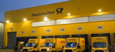 FILE PHOTO: Delivery cars are lined up at a distribution centre of German postal and logistics group Deutsche Post DHL in Hamburg, Germany, December 8, 2022. REUTERS/Fabian Bimmer/File Photo