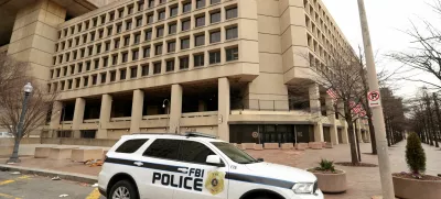 FILE PHOTO: An FBI police car stands outside FBI headquarters, days after the Trump administration launched a sweeping round of cuts at the Justice Department, in Washington, U.S., February 3, 2025. REUTERS/Kevin Lamarque/File Photo