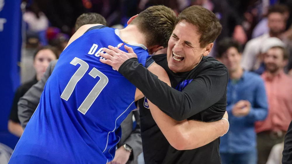 Nov 18, 2019; Dallas, TX, USA; Dallas Mavericks owner Mark Cuban hugs forward Luka Doncic (77) after the win over the San Antonio Spurs at the American Airlines Center. Mandatory Credit: Jerome Miron-USA TODAY Sports