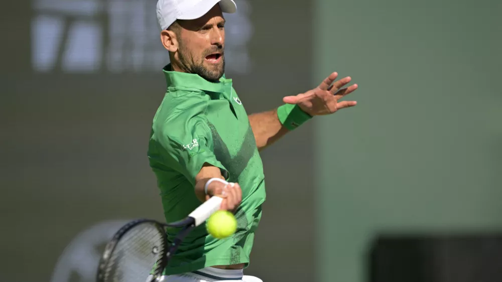 Mar 8, 2025; Indian Wells, CA, USA; Novak Djokovic (SRB) hits a shot against Botic Van De Zandschulp (not pictured) during the second round of the BNP Paribas Open at the Indian Well Tennis Garden. Mandatory Credit: Jayne Kamin-Oncea-Imagn Images