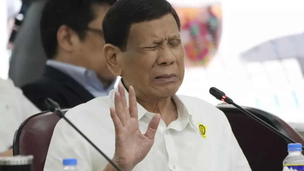 FILE - Former Philippine President Rodrigo Duterte gestures as he answers questions during a joint committee hearing of the House of Representatives investigating the war on drugs during his administration in Quezon City, Philippines on Nov. 13, 2024. (AP Photo/Aaron Favila, File)