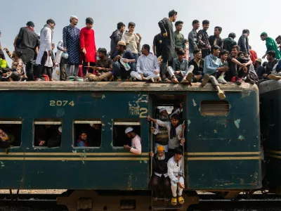 February 11, 2024, Dhaka, Dhaka, Bangladesh: Muslim devotees sit on an overcrowded train during The Bishaw Ijtema in Dhaka, Bangladesh on February 11, 2024. Every year thousands of Muslims from all over the world, especially from Bangladesh and Pakistan, gather at The Bishaw Ijtema, where devotees perform daily prayers while listening to scholars reciting and explaining verses from the holy Quran.,Image: 856004293, License: Rights-managed, Restrictions:, Model Release: no
