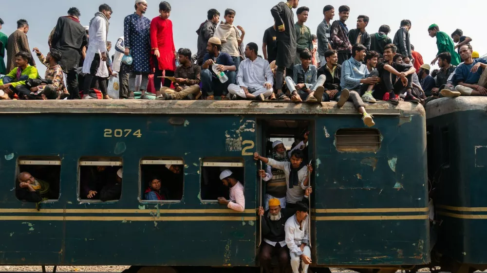 February 11, 2024, Dhaka, Dhaka, Bangladesh: Muslim devotees sit on an overcrowded train during The Bishaw Ijtema in Dhaka, Bangladesh on February 11, 2024. Every year thousands of Muslims from all over the world, especially from Bangladesh and Pakistan, gather at The Bishaw Ijtema, where devotees perform daily prayers while listening to scholars reciting and explaining verses from the holy Quran.,Image: 856004293, License: Rights-managed, Restrictions:, Model Release: no