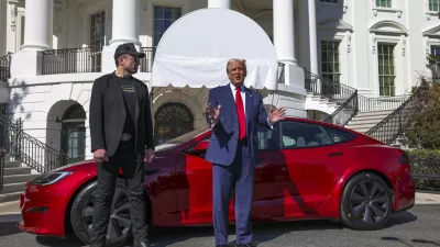 President Donald Trump and Tesla CEO Elon Musk speak to reporters in front of a red Model S Tesla vehicle on the South Lawn of the White House Tuesday, March 11, 2025, in Washington. (Pool via AP)