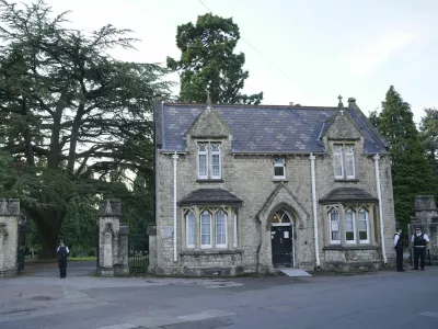 A view of the entrance to Lavender cemetery in Enfield, north London where triple murder suspect Kyle Clifford, 26, was found by officers on Wednesday afternoon, July 10, 2024. British police said they found Wednesday the man suspected of killing the wife and two daughters of a well-known BBC radio commentator near London in a brutal crossbow attack. (Jonathan Brady/PA via AP)