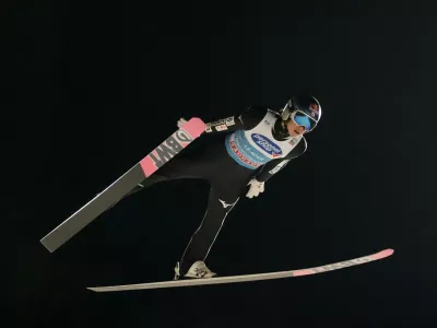 Ryoyu Kobayashi of Japan soars through the air during the fourth stage of the 72th Four Hills ski jumping tournament in Bischofshofen, Austria, Friday, Jan. 5, 2024. (AP Photo/Matthias Schrader)