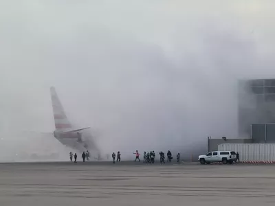Smoke rises as passengers get evacuated, after an American Airlines jet engine caught fire, in Denver, Colorado, U.S., MARCH 13, 2025, in this screengrab obtained from a social media video. Aaron Clark/via REUTERS THIS IMAGE HAS BEEN SUPPLIED BY A THIRD PARTY. MANDATORY CREDIT. NO RESALES. NO ARCHIVES.