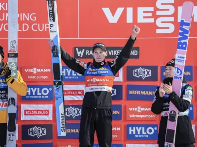 Andreas Wellinger from Germany, left, Domen Prevc from Slovenia, center, and Ryoyu Kobayashi from Japan, on the podium following a ski jumping Raw Air competition in Vikersund, Norway, Sunday, March 16, 2025. (Terje Bendiksby/NTB Scanpix via AP)
