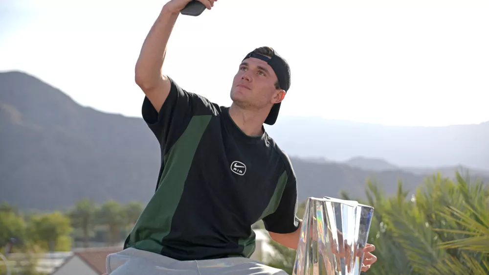 Mar 16, 2025; Indian Wells, CA, USA; Jack Draper (GBR) takes a selfie with the championship trophy after defeating Holger Rune (not pictured) in the final of the BNP Paribas Open at the Indian Well Tennis Garden. Mandatory Credit: Jayne Kamin-Oncea-Imagn Images
