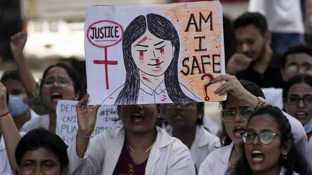 Resident doctors and medical students stage a protest against the alleged rape and killing of a doctor, at Kolkata's RG Kar Medical College and Hospital in Mumbai, India, Saturday, Aug. 17, 2024. (AP Photo/Rajanish Kakade)