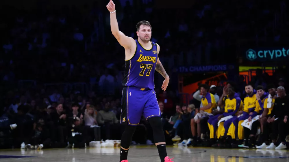 Mar 17, 2025; Los Angeles, California, USA; Los Angeles Lakers guard Luka Doncic (77) reacts against the San Antonio Spurs in the first half at Crypto.com Arena. Mandatory Credit: Kirby Lee-Imagn Images