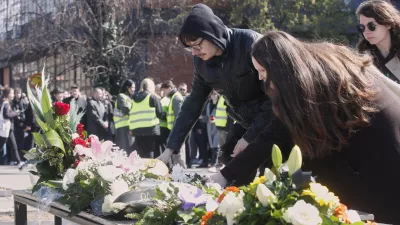 People lay flowers for the victims of a massive nightclub fire in the town of Kocani, in Skopje, North Macedonia, Tuesday, March 18, 2025. (AP Photo/Boris Grdanoski)