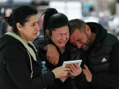 Families and friends grieve for victims at the main square following a fire at the Pulse nightclub that resulted in dozens of deaths in the town of Kocani, North Macedonia, March 18, 2025. REUTERS/Alexandros Avramidis