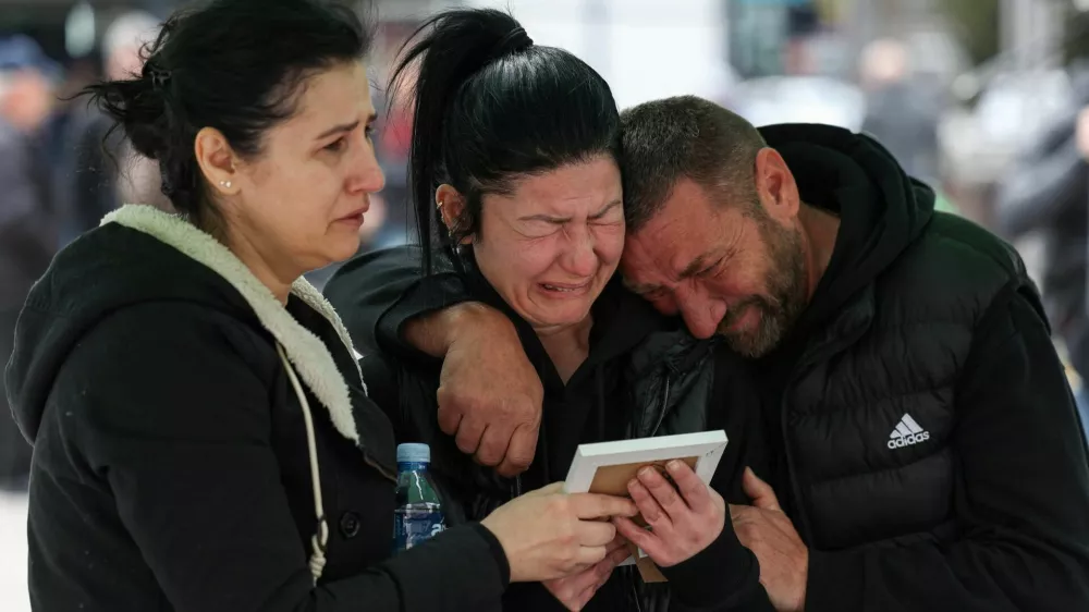 Families and friends grieve for victims at the main square following a fire at the Pulse nightclub that resulted in dozens of deaths in the town of Kocani, North Macedonia, March 18, 2025. REUTERS/Alexandros Avramidis