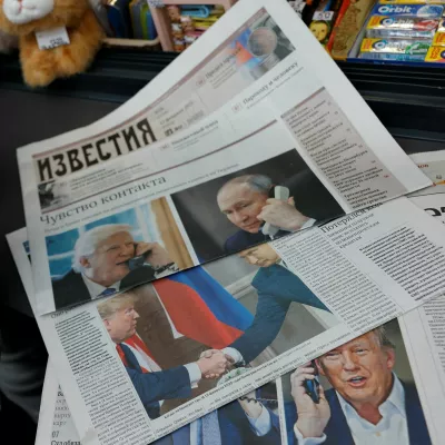 Daily newspapers with covers, dedicated to the recent phone call of Russian President Vladimir Putin and U.S. President Donald Trump, are laid out at a newsstand in a street in Moscow, Russia, February 13, 2025. REUTERS/Maxim Shemetov/Illustration