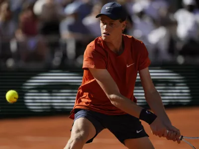 FILE - Italy's Jannik Sinner plays a shot against Spain's Carlos Alcaraz during their semifinal match of the French Open tennis tournament at the Roland Garros stadium in Paris, Friday, June 7, 2024. (AP Photo/Thibault Camus, File)