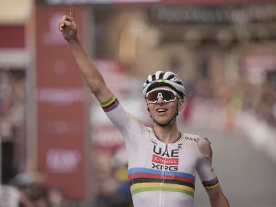 Tadej Pogačar riding for the UAE Team Emirates celebrates winning 19th edition of the Strade Bianche (White Roads) a 213 km one day race from Siena, Italy, Saturday March 8, 2025. (Marco AlpozziLaPresse via AP)